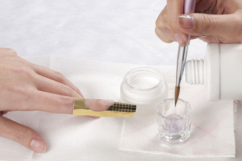 Premium Photo | Close up of the process of applying acrylic powder on the  nails of a young woman in a beauty salon