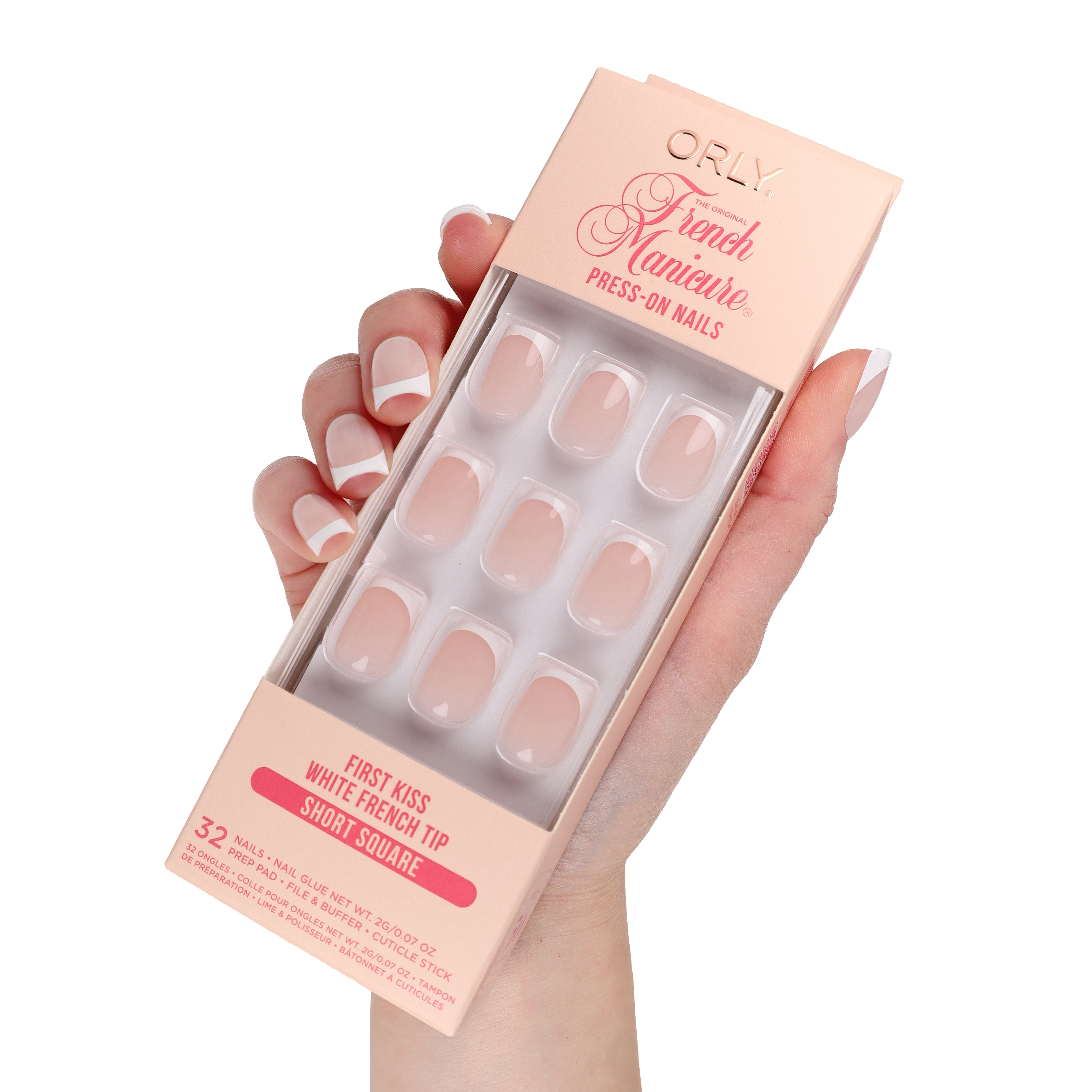 Orly French Manicure press-on nails packaging held by a hand with white nail polish.