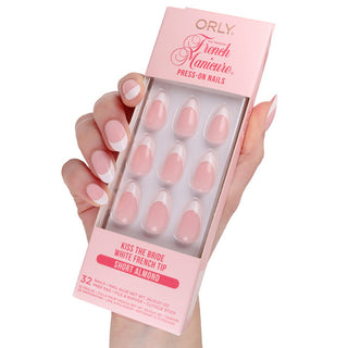 Orly press-on nails packaging held by a hand with matching nails on a white background