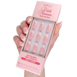 Orly French Manicure press-on nails packaging held by a hand on a white background